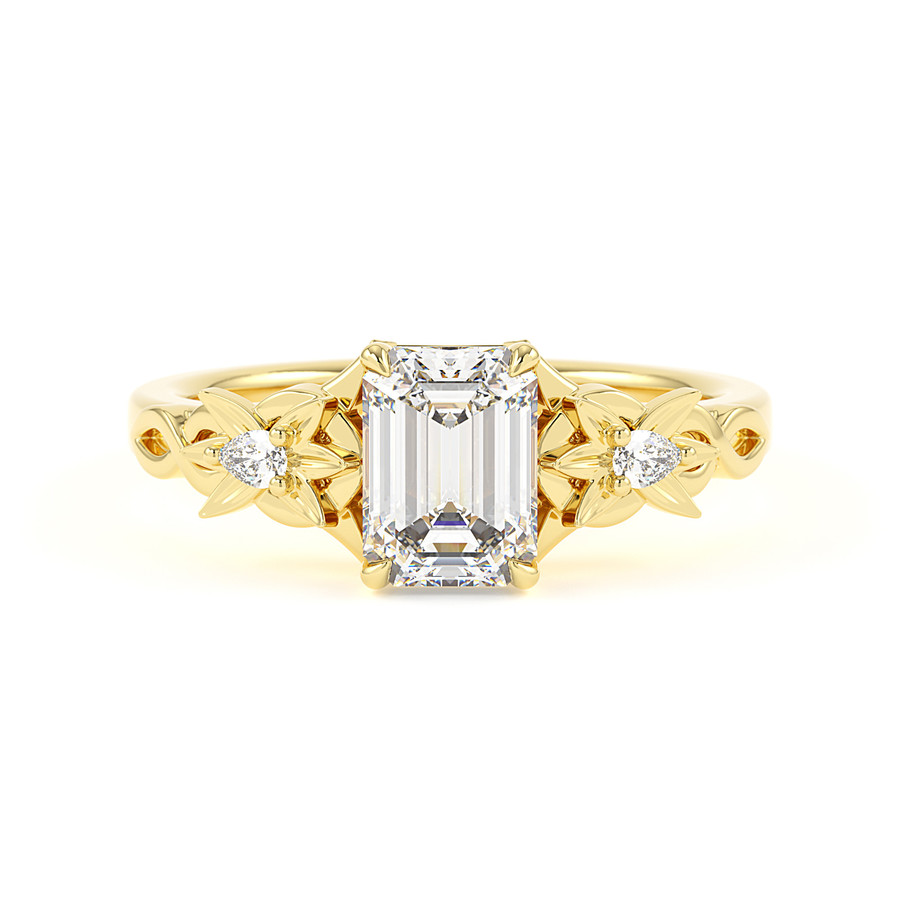 Floral emerald and pear diamond trilogy ring