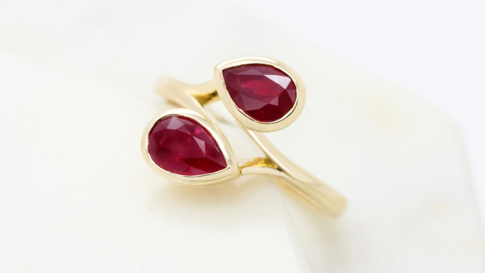 14576 - pear shape ruby moi et toi yellow gold engagement ring