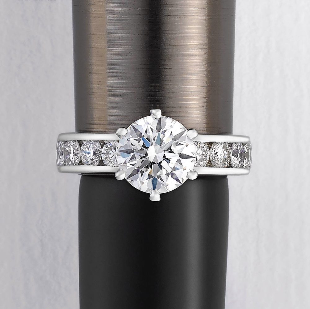 six prong bezel set pavé round soliatire engagement ring