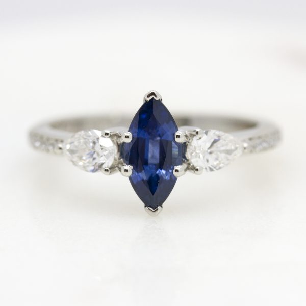 blue sapphire marquise diamond trilogy engagement ring