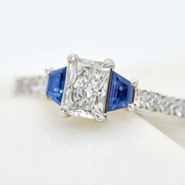 blue sapphire trapezoid side stones