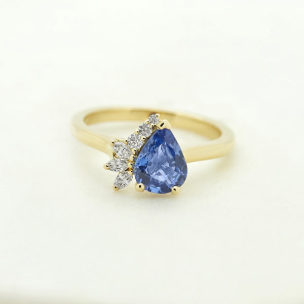 Blue pear shaped sapphire set in yellow gold