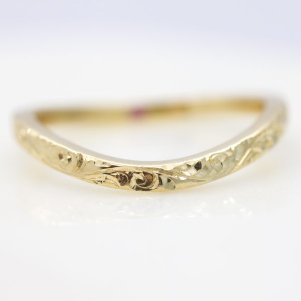 curved hand engraved yellow gold wedding ring