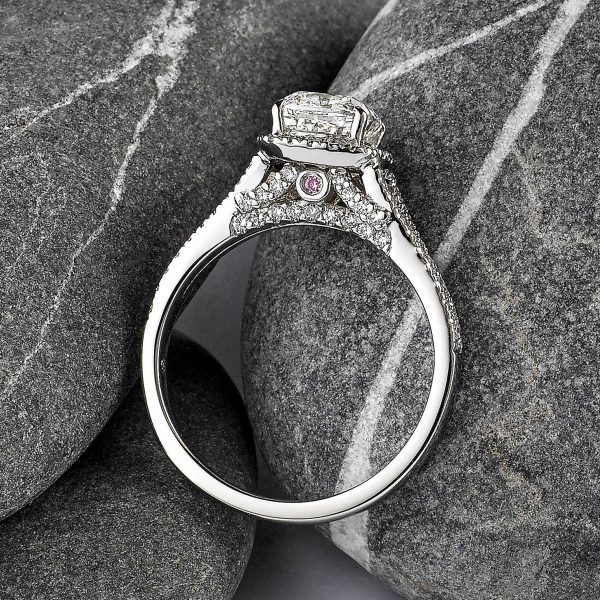 Cushion-cut diamond center with pavé diamond gallery & band set in platinum