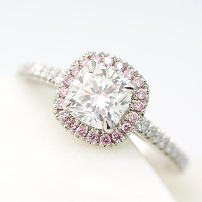 cushion cut diamond with pink diamond halo