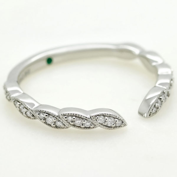 Platinum wedding band with floral design and round diamonds