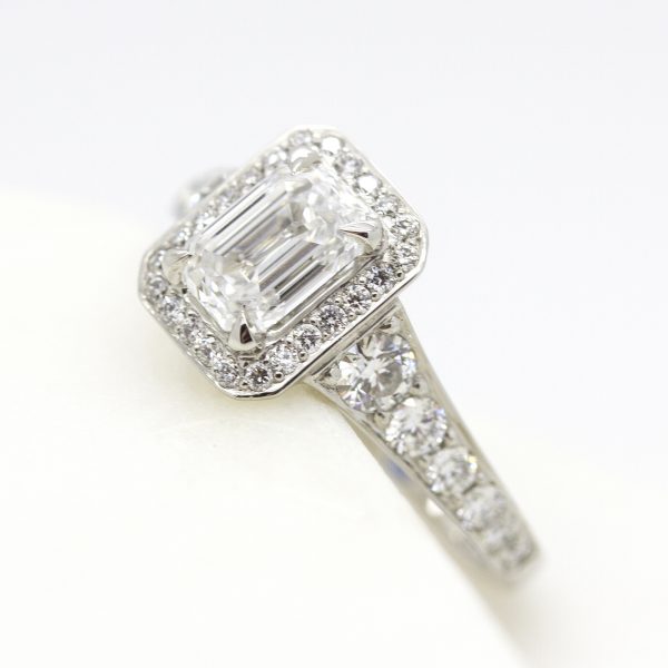 emerald cut diamond halo engagement ring with bead set diamond band