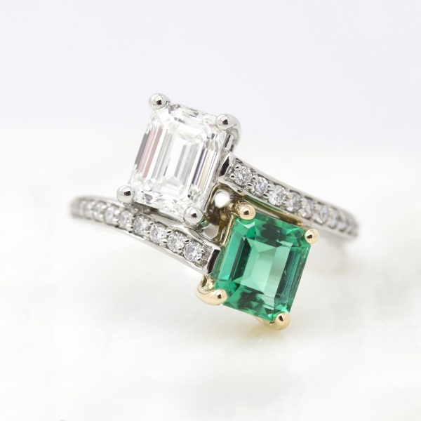 emerald cut emerald and diamond moi et toi engagement ring