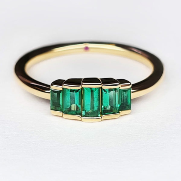 Emerald baguette cluster engagement ring set in yellow gold