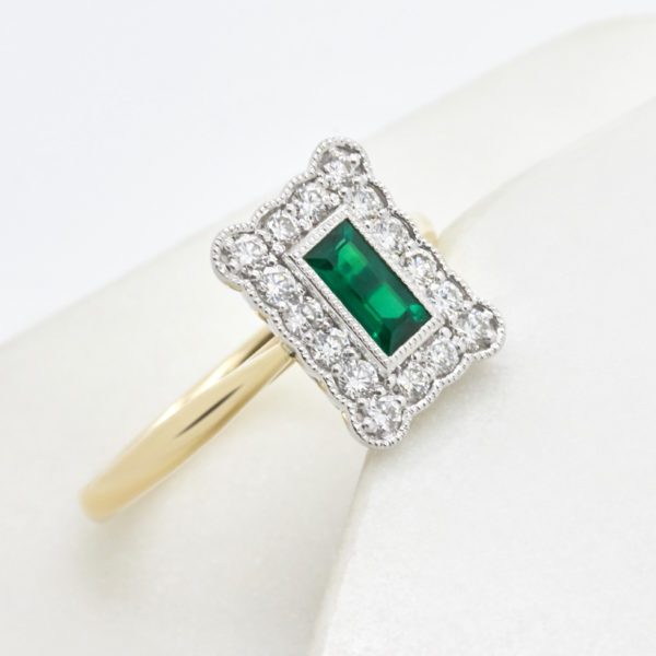 Vintage emerald yellow gold and platinum diamond halo engagement ring