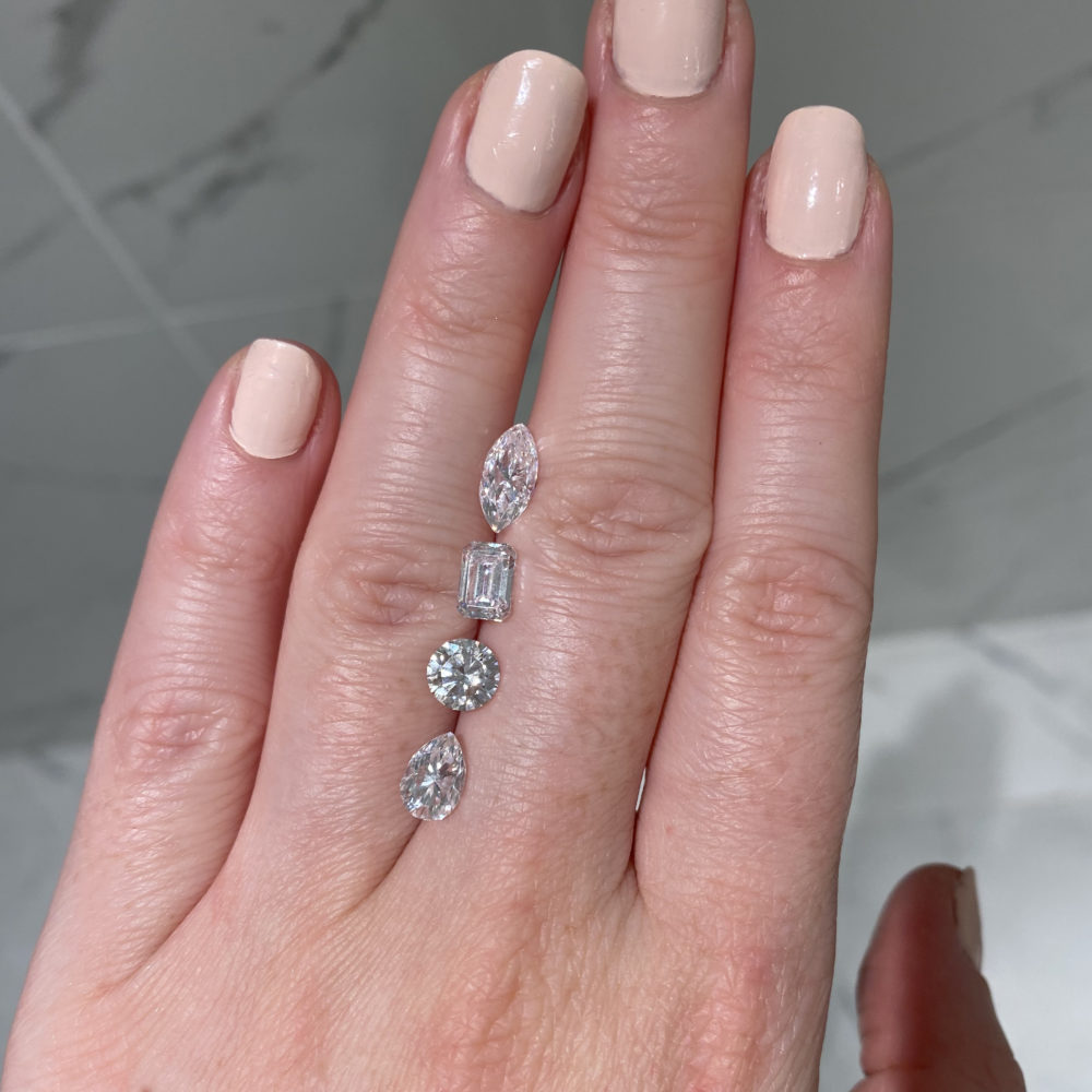 fancy shape diamond carat weight comparison 0.9ct on hand