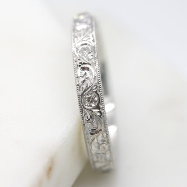 hand engraved platinum wedding band with ivy and vine motif