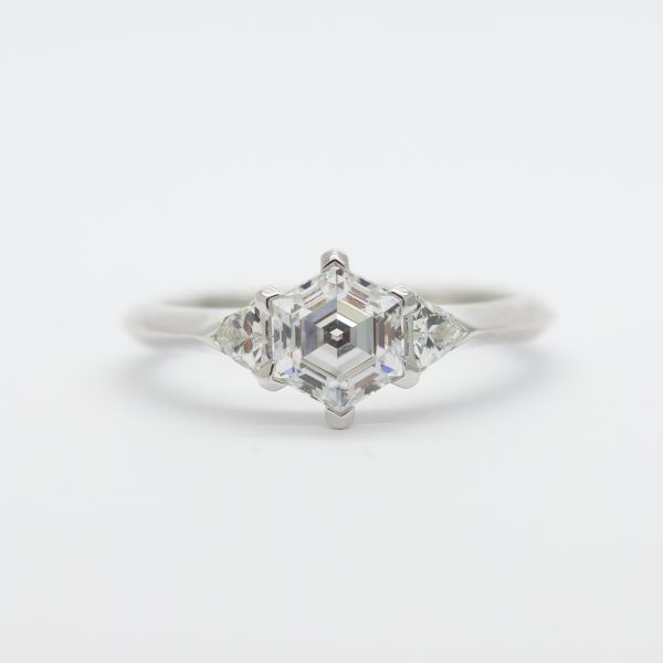 hexagon centre diamond with trilliant side diamonds