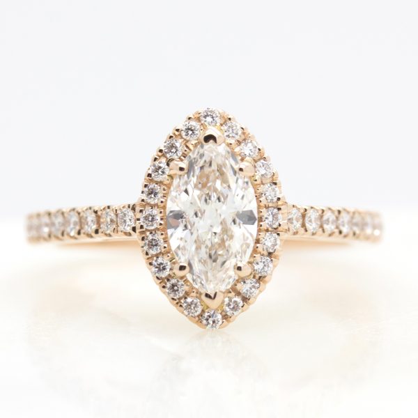 marquise cut diamond with diamond halo set in rose gold engagement ring