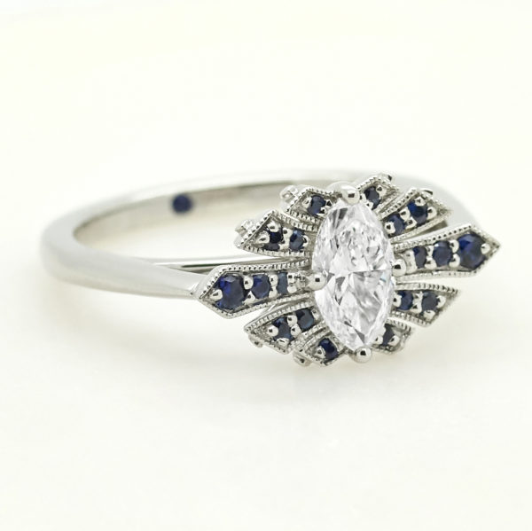 marquise diamond custom engagement ring with fanned pave blue sapphires