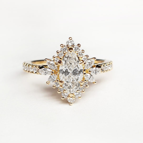 Marquise diamond engagement ring in yellow gold with a marquise halo