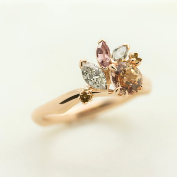 Rose gold engagement ring with brown, pink and white diamonds