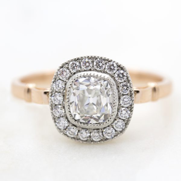 old mine cut diamond with diamond halo in rose gold and platinum