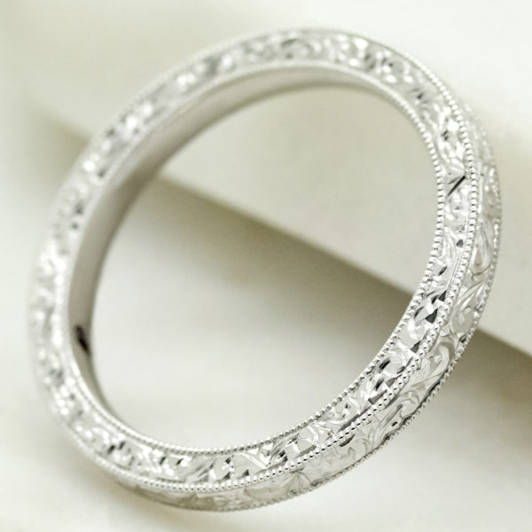 Vintage platinum wedding band with engraving and milgrain