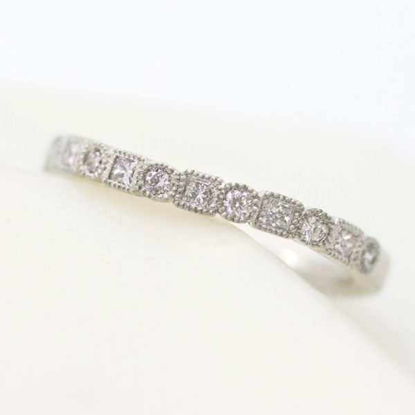 Vintage platinum wedding band with square and round diamonds with milgrain