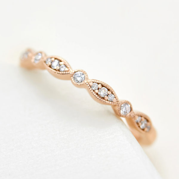 Vintage rose gold wedding band with diamonds and milgrain