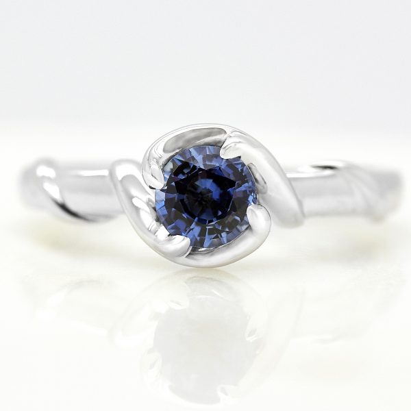 round blue sapphire with organic inspired branch band in platinum engagement ring