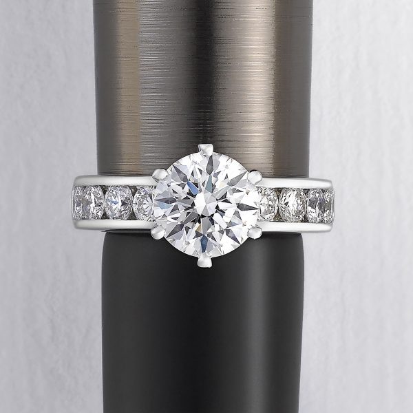 round diamond with channel set diamonds