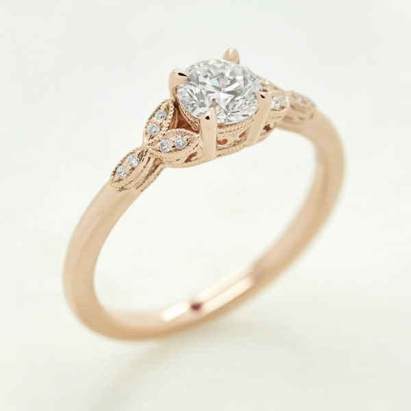 round diamond with marquise style sides rose gold