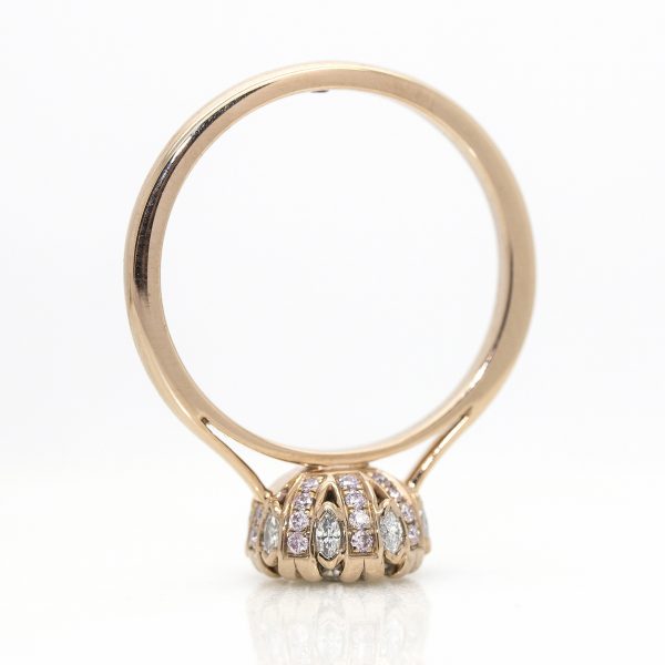 round diamond with pink and white diamonds collet details cathedral setting