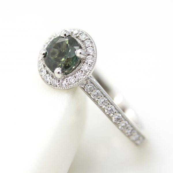round green sapphire diamond halo engagement ring with milgrain