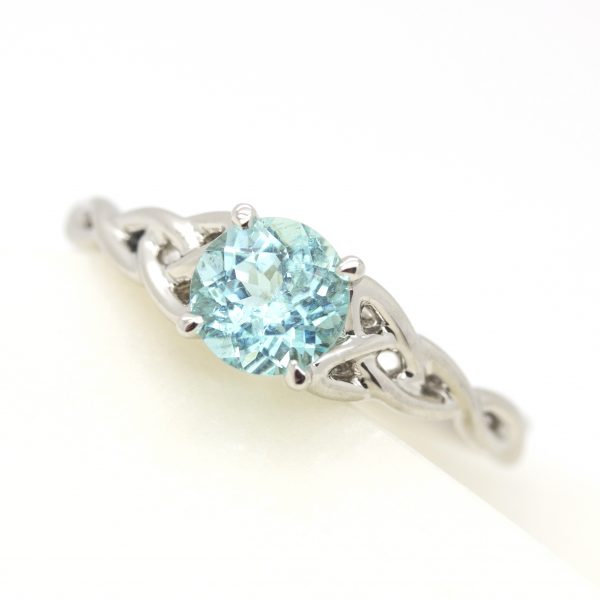 round paraiba tourmaline with gaelic celtic inspired band engagement ring