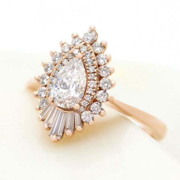 unique engagement ring with pear centre diamond double diamond halo and fanned tapered baguettes