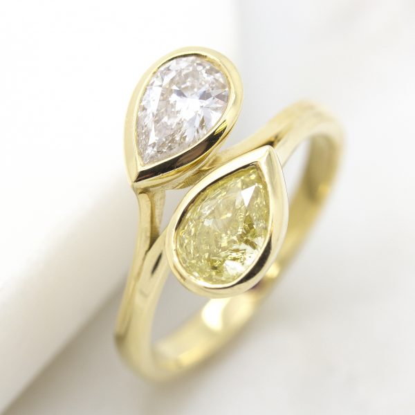 yellow and white pear cut diamonds in a moi et toi yellow gold engagement ring